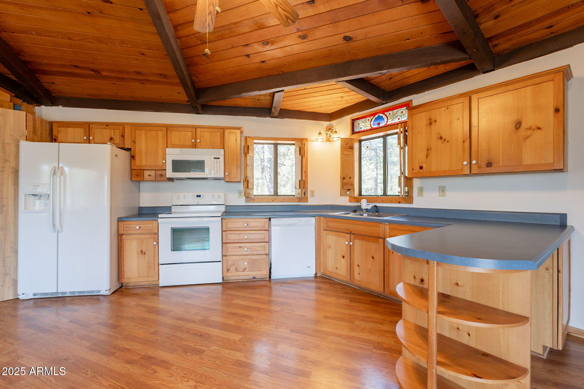 3524 Kelly Circle Pine, AZ 85544 - Photo 8 of 69 a kitchen with stainless steel appliances granite countertop a sink a stove and a refrigerator