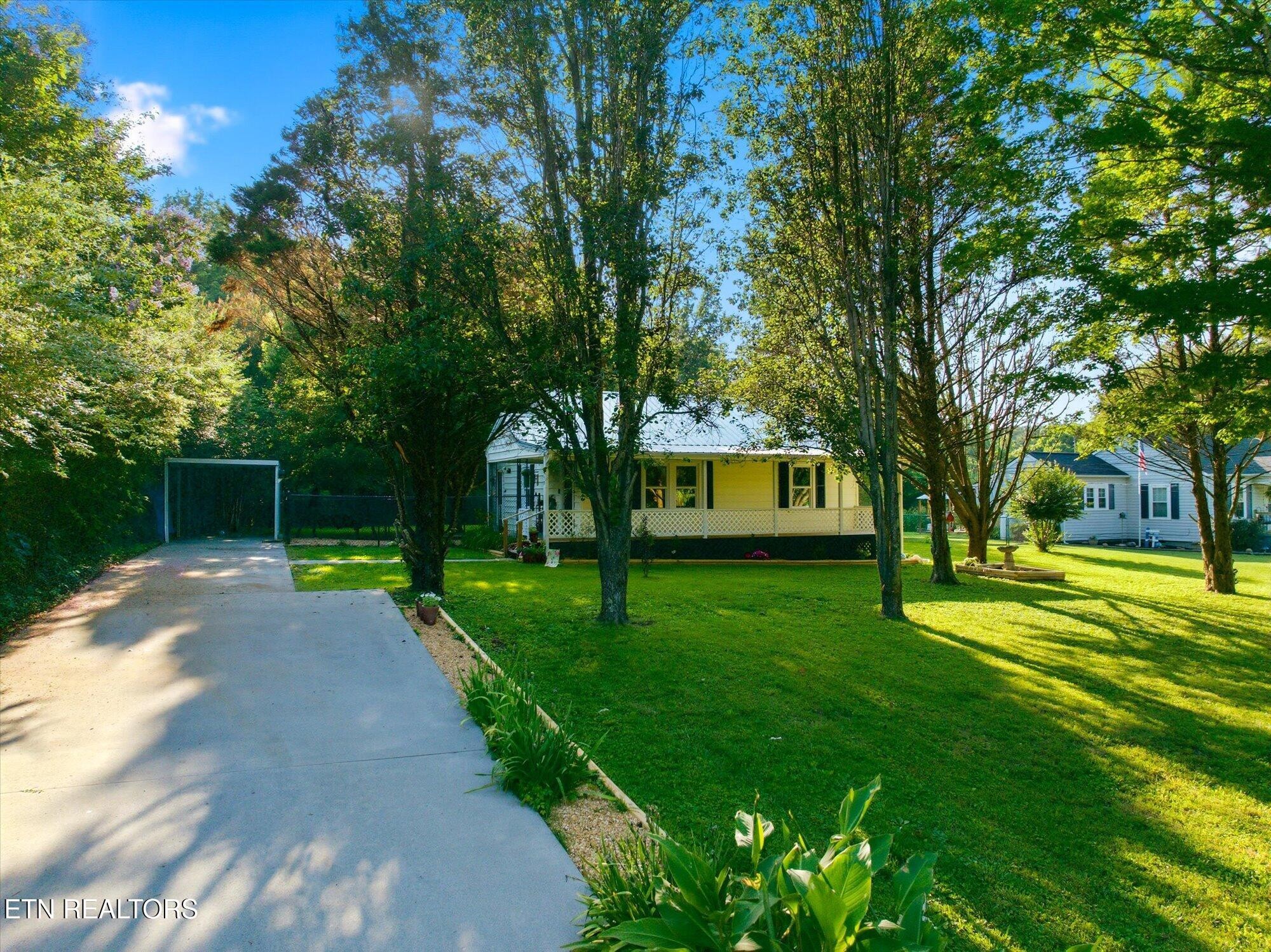159 Mill Street Delano, TN 37325 - Photo 3 of 22 a front view of a house with garden