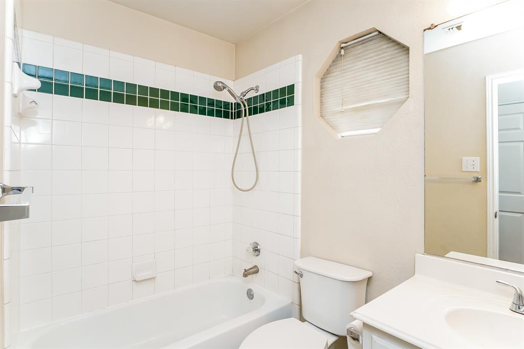 10706 Robincreek Lane Frisco, TX 75035 - Photo 14 of 17 Bathroom with bathing tub / shower combination and vanity