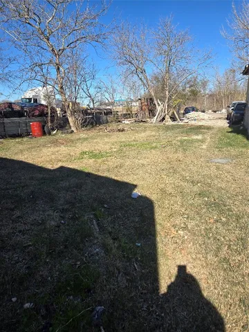 a view of open space with a big yard