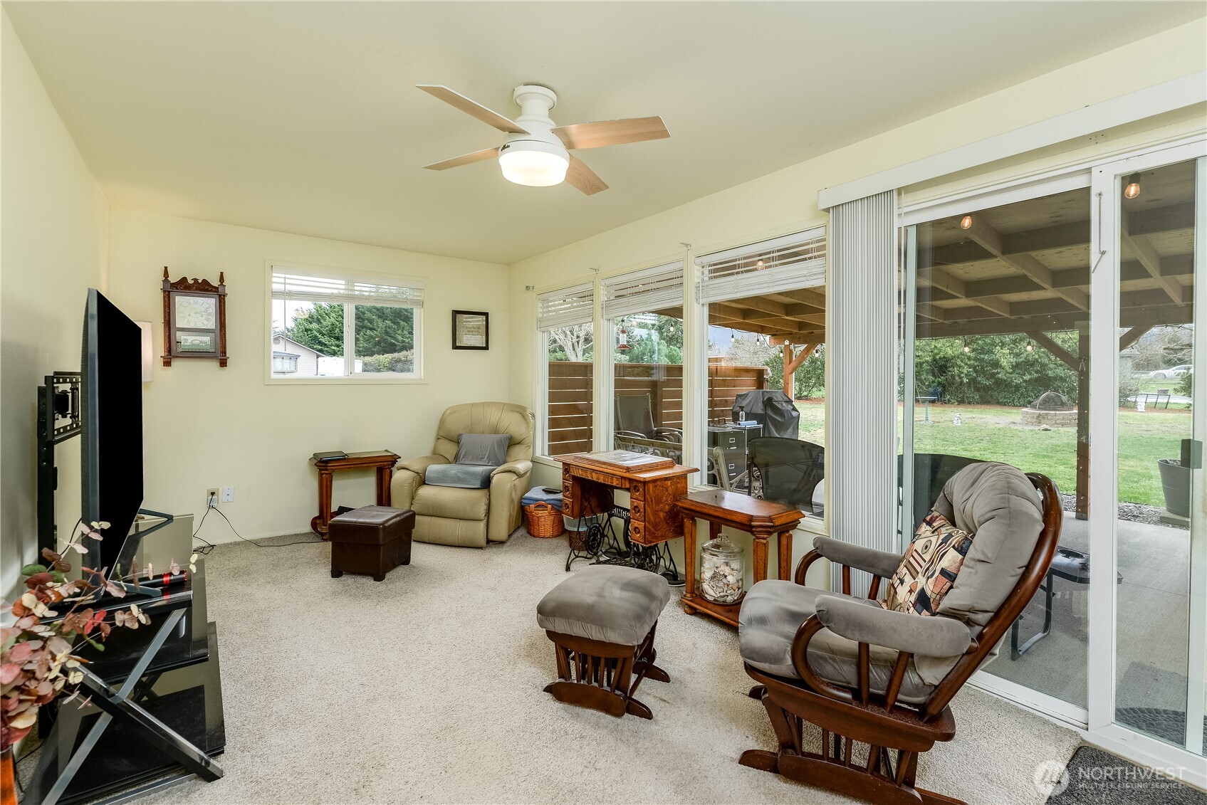 1111 West Alder Court Sequim, WA 98382 - Photo 15 of 37 a living room with furniture gym equipment and a large window