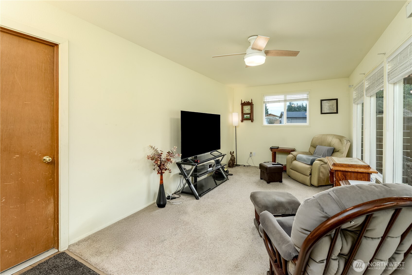 1111 West Alder Court Sequim, WA 98382 - Photo 16 of 37 a living room with furniture and a flat screen tv