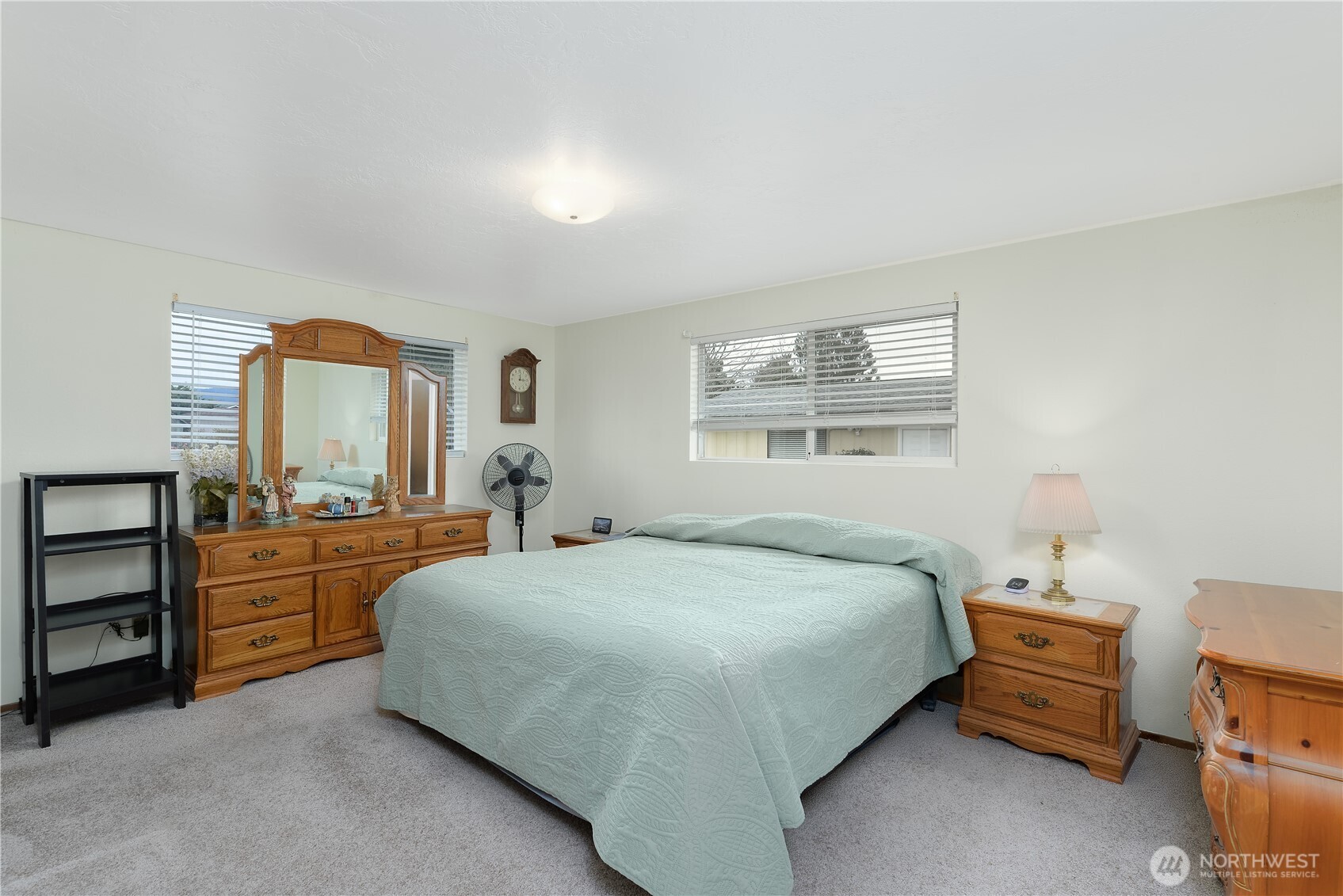 1111 West Alder Court Sequim, WA 98382 - Photo 18 of 37 a bedroom with a bed and a dresser