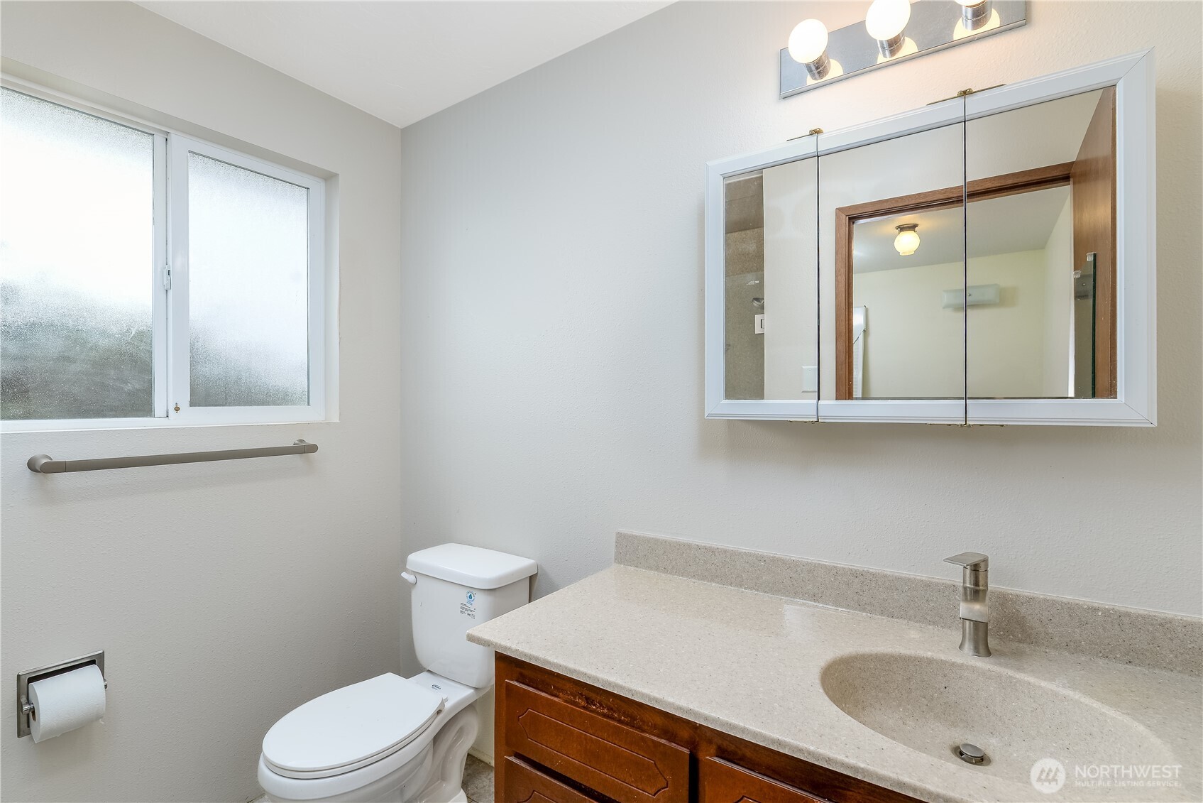 1111 West Alder Court Sequim, WA 98382 - Photo 21 of 37 a bathroom with a sink a toilet and mirror