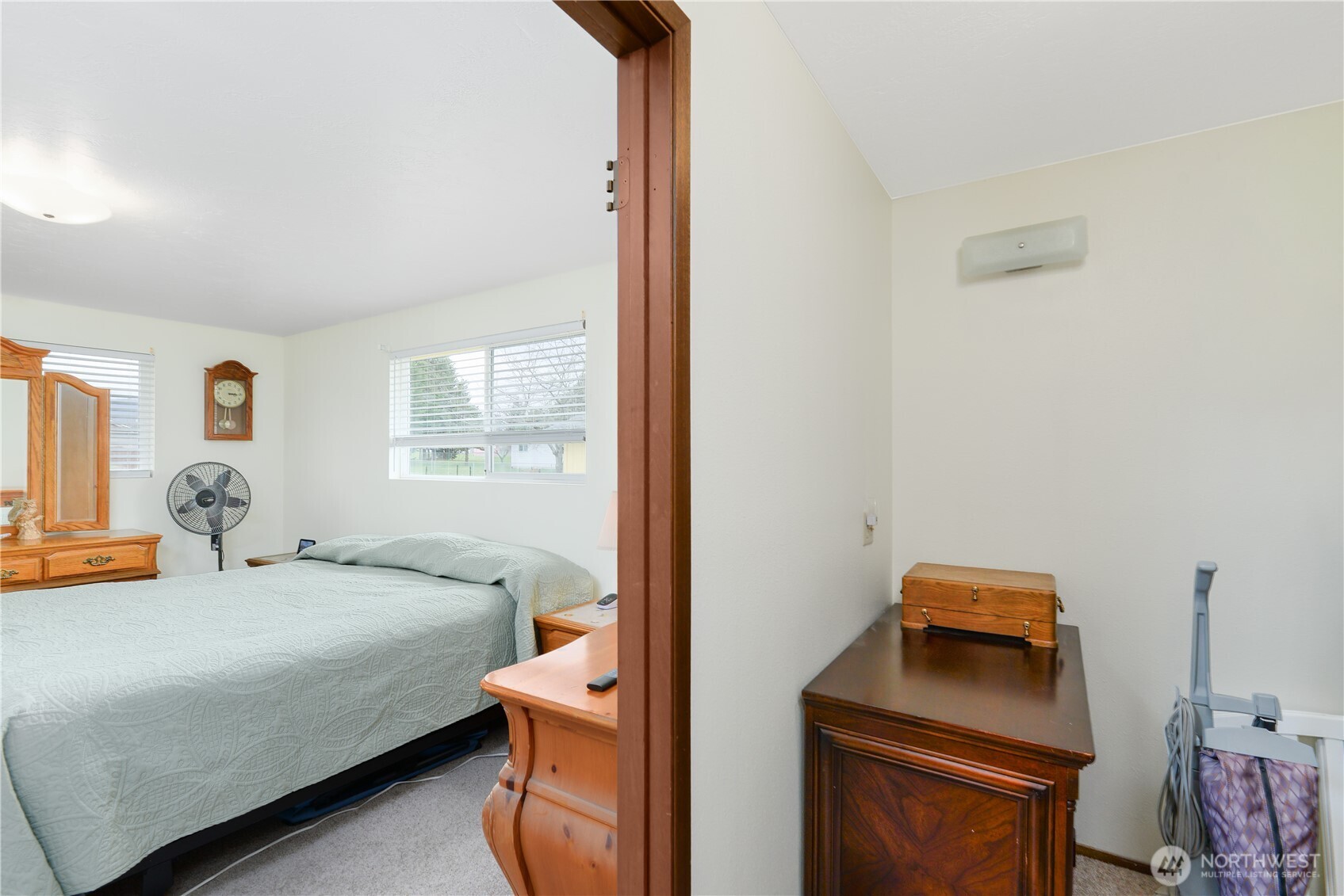 1111 West Alder Court Sequim, WA 98382 - Photo 24 of 37 a bedroom with a bed and a dresser