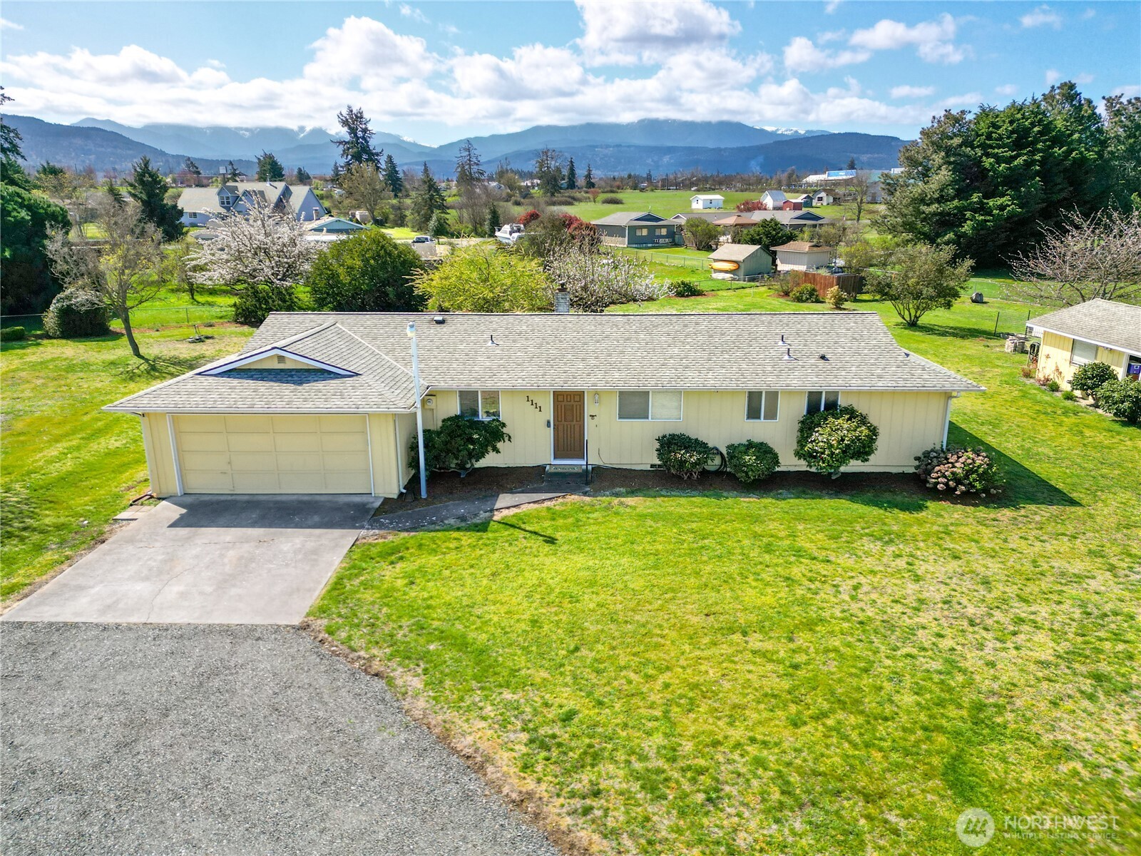 1111 West Alder Court Sequim, WA 98382 - Photo 28 of 37 a view of a house with a yard