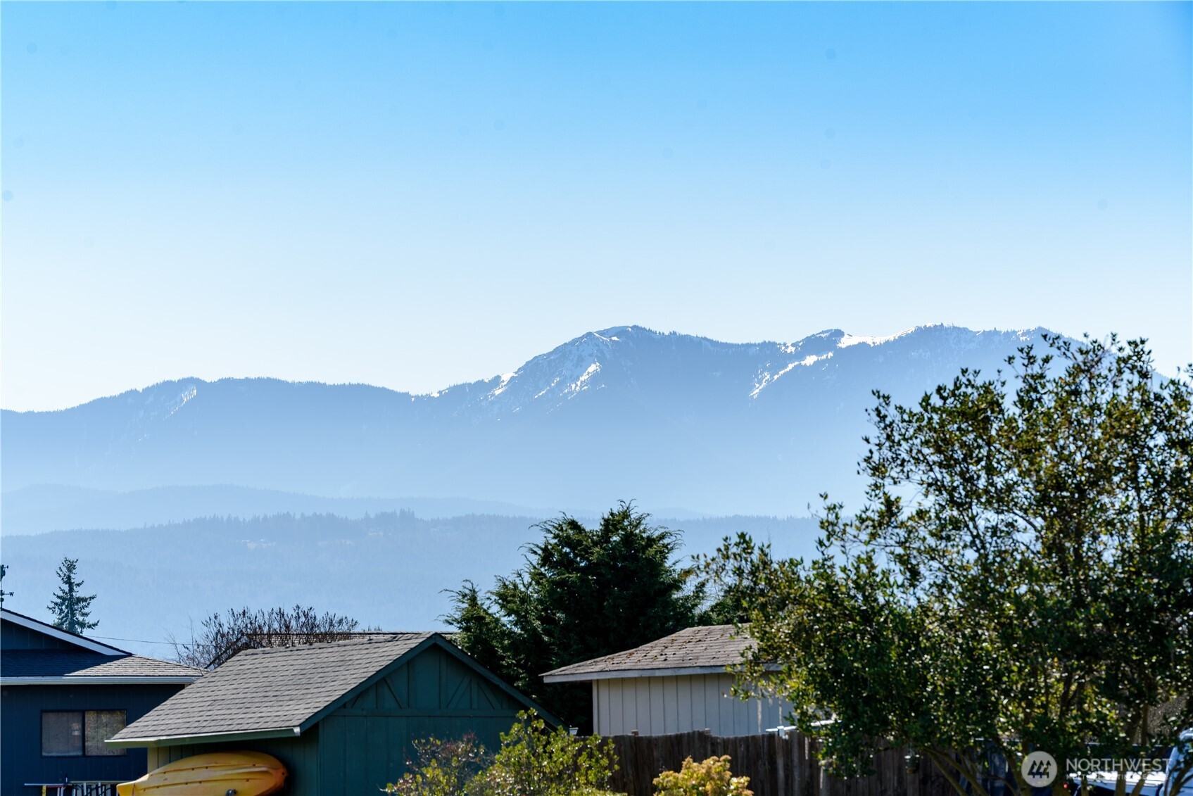 1111 West Alder Court Sequim, WA 98382 - Photo 3 of 37 a view of a city with a mountain