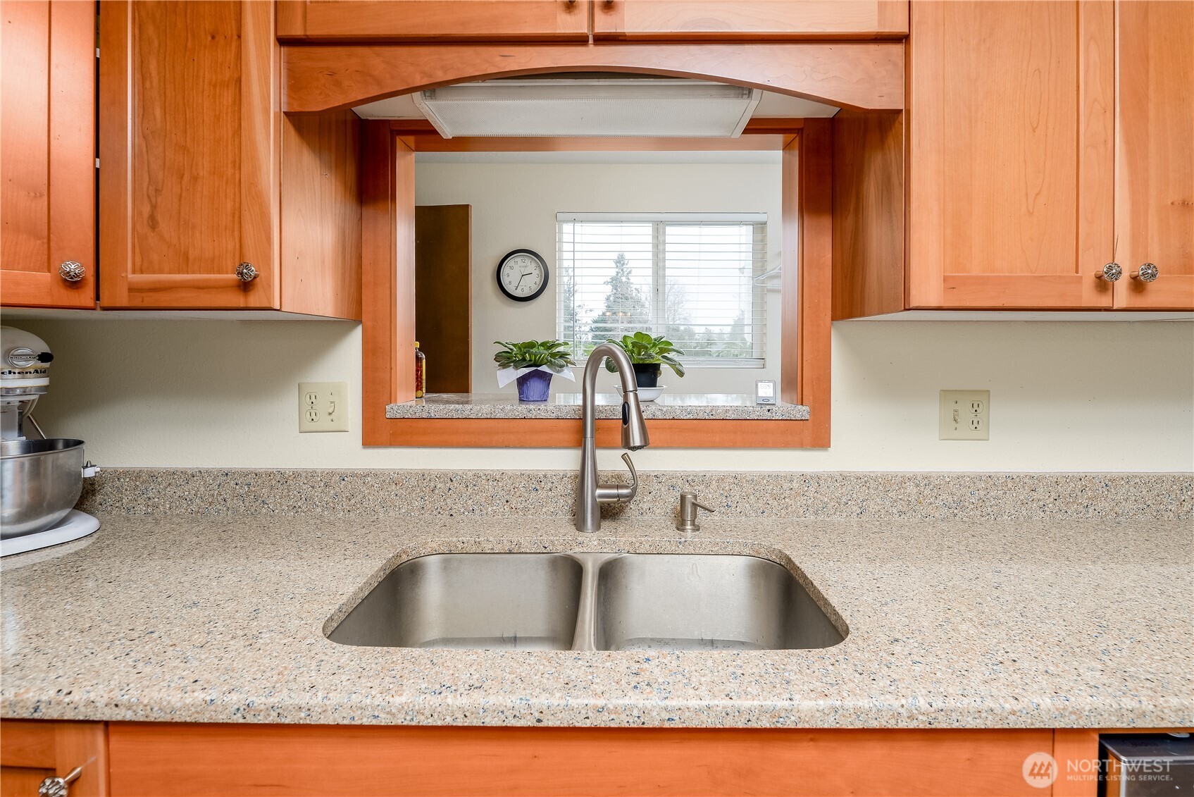 1111 West Alder Court Sequim, WA 98382 - Photo 7 of 37 a kitchen with granite countertop a sink and a window