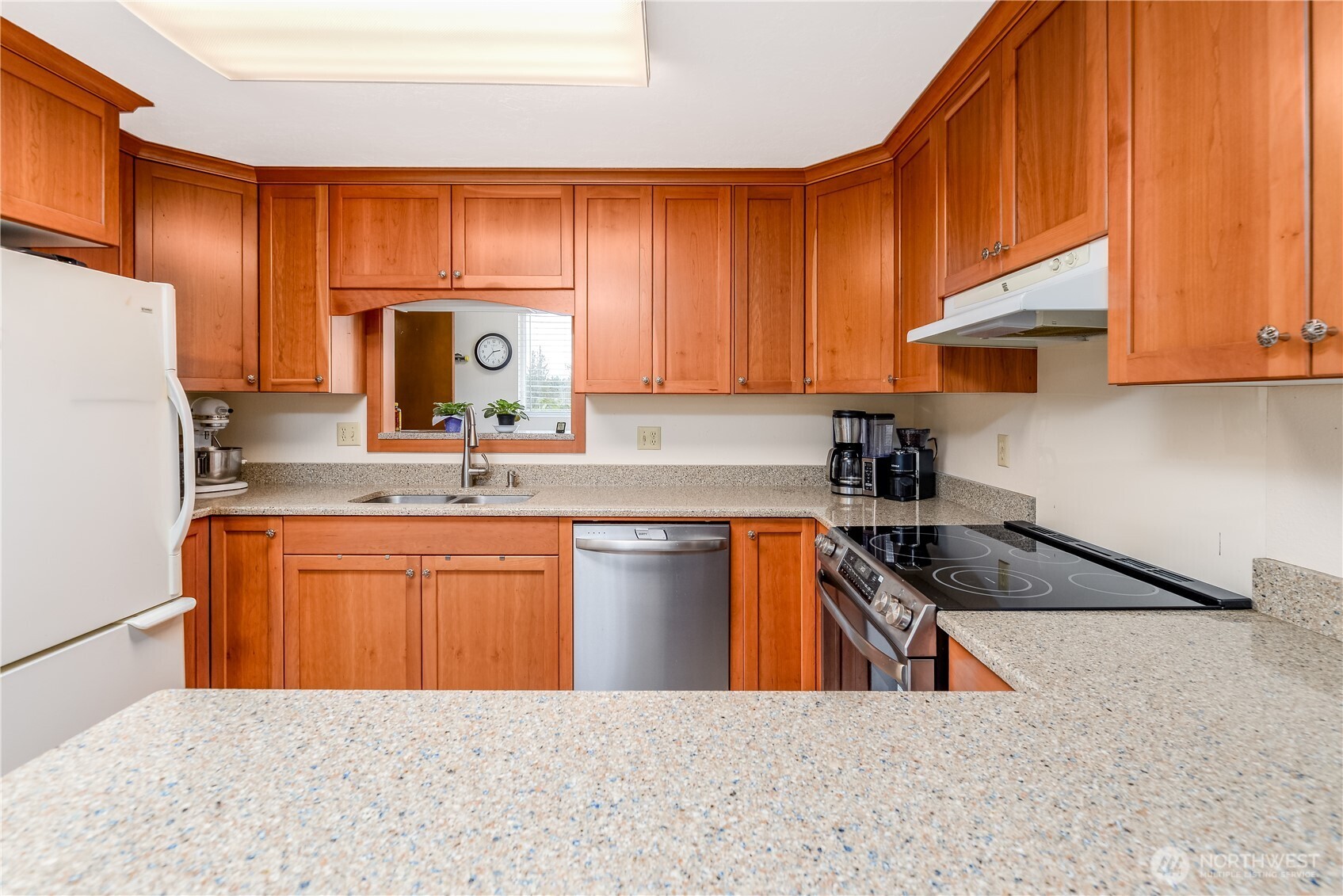 1111 West Alder Court Sequim, WA 98382 - Photo 8 of 37 a kitchen with stainless steel appliances granite countertop a sink stove and refrigerator