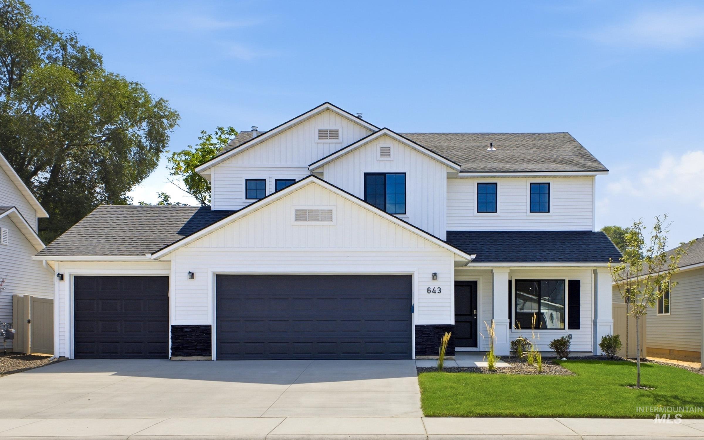13336 Bank Street Caldwell, ID 83607 - Photo 1 of 24 Contemporary two-story residence with white siding and a dark gray roof