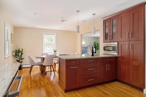 a kitchen with wooden cabinets and sink