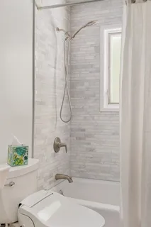 a bathroom with a sink a toilet and a bathtub