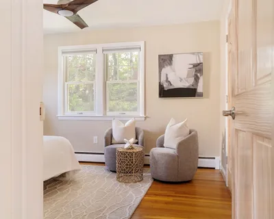 a living room with furniture and a window