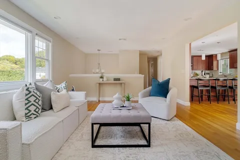 a living room with furniture and a table