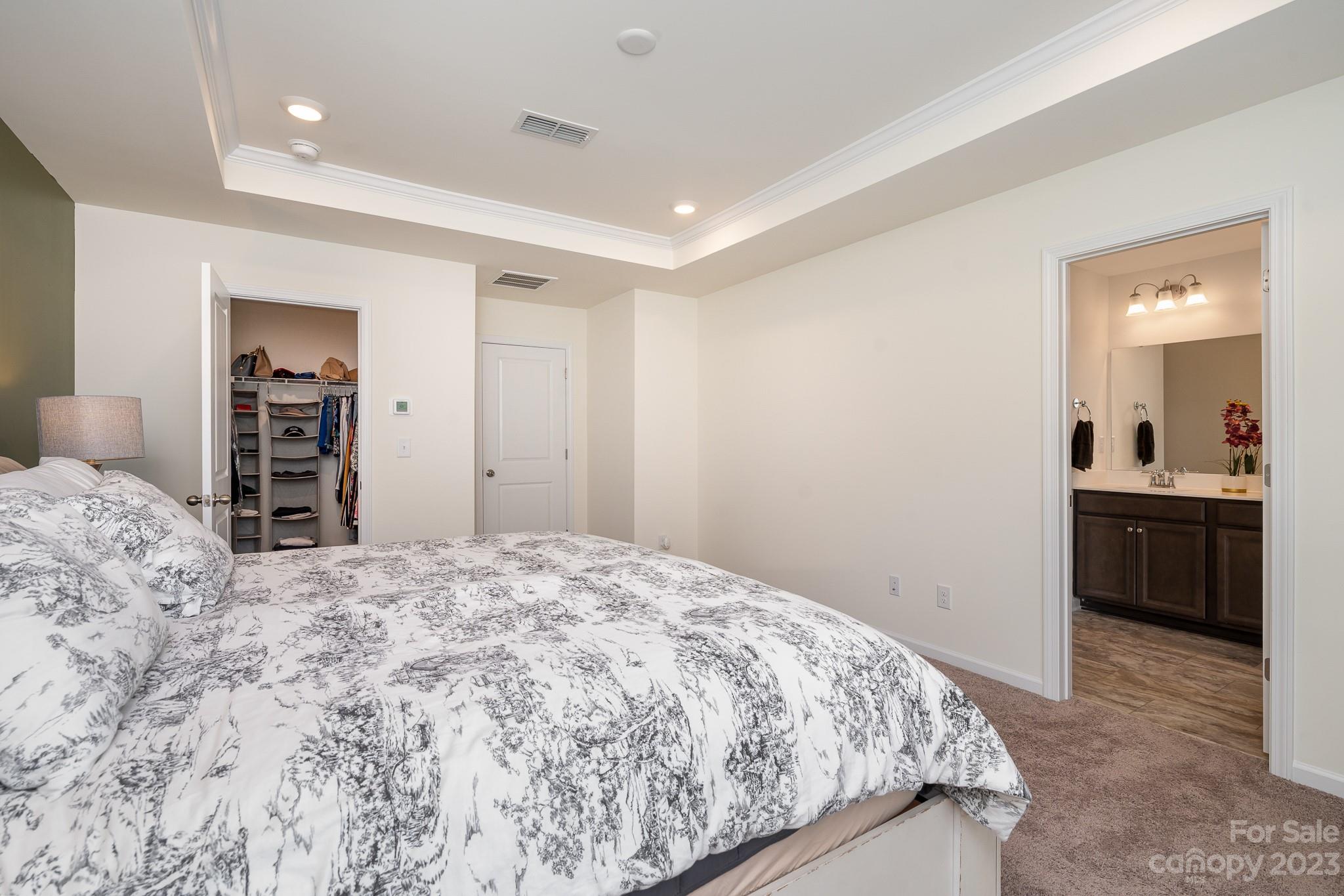 229 Quinn Road Matthews, NC 28104 - Photo 13 of 23 a bedroom with a bed and a bathroom