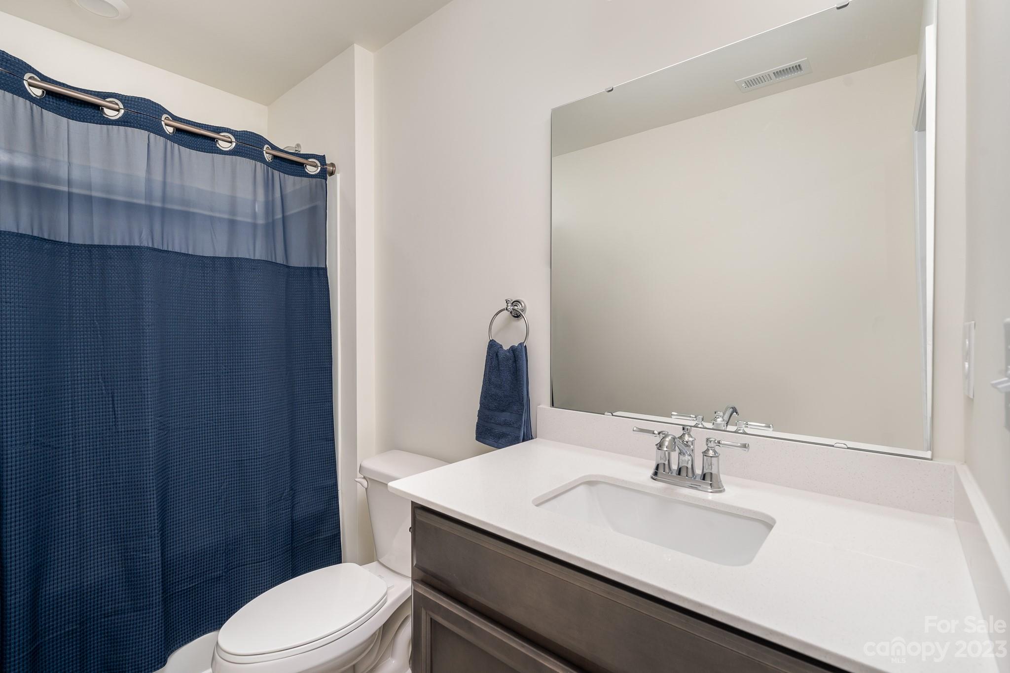 229 Quinn Road Matthews, NC 28104 - Photo 19 of 23 a bathroom with a sink vanity mirror and toilet