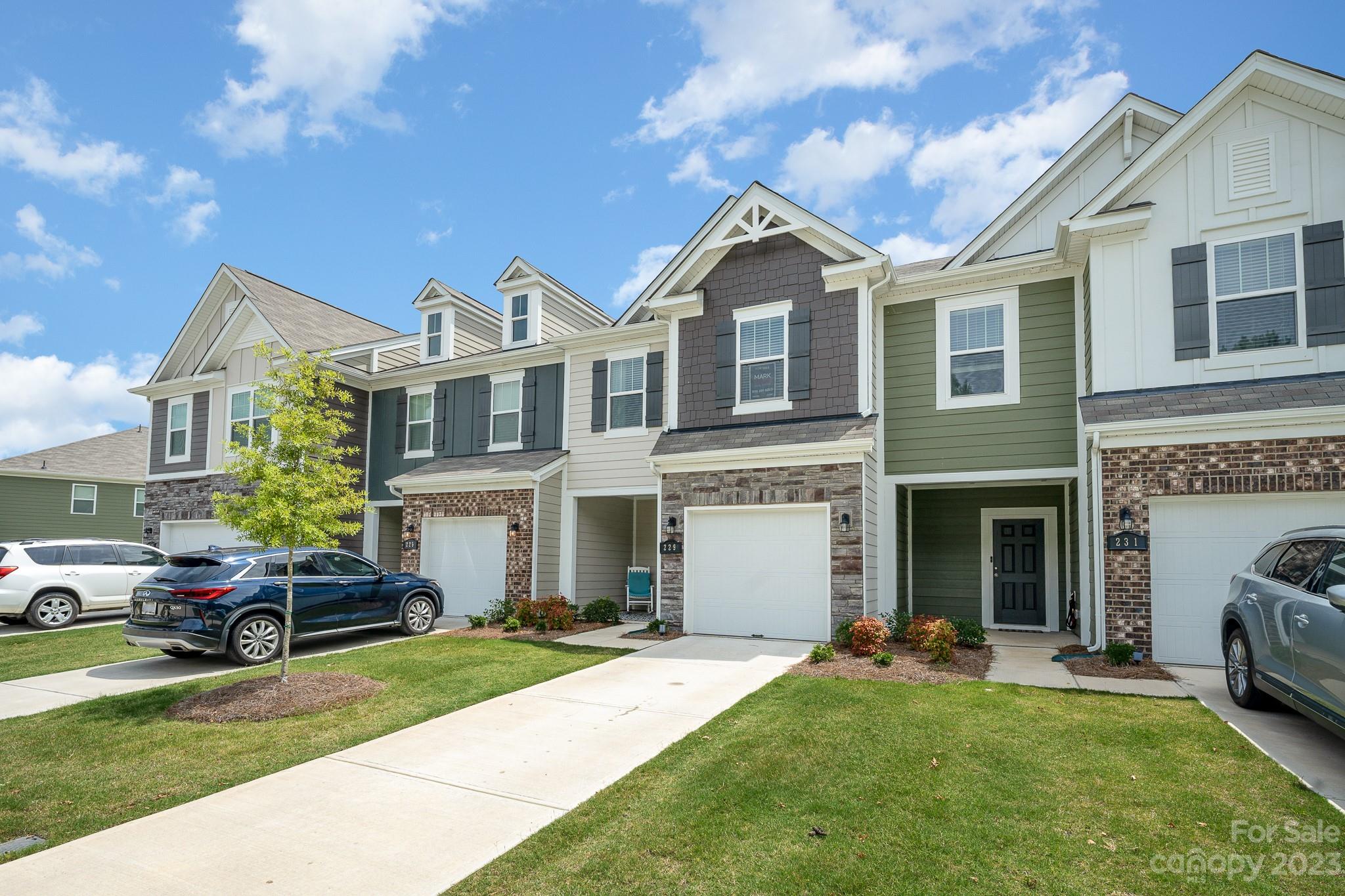 229 Quinn Road Matthews, NC 28104 - Photo 2 of 23 a front view of a house with a yard