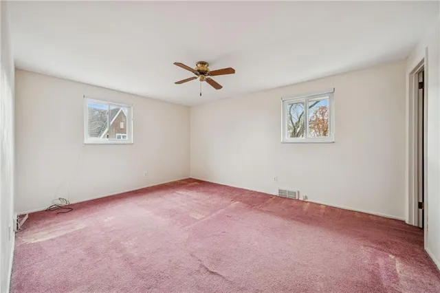 a view of a big room with carpet