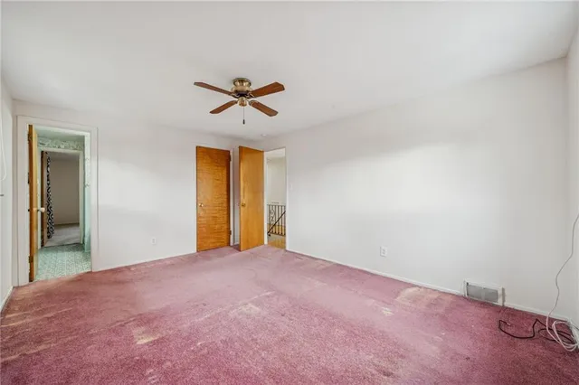 a view of empty room with windows