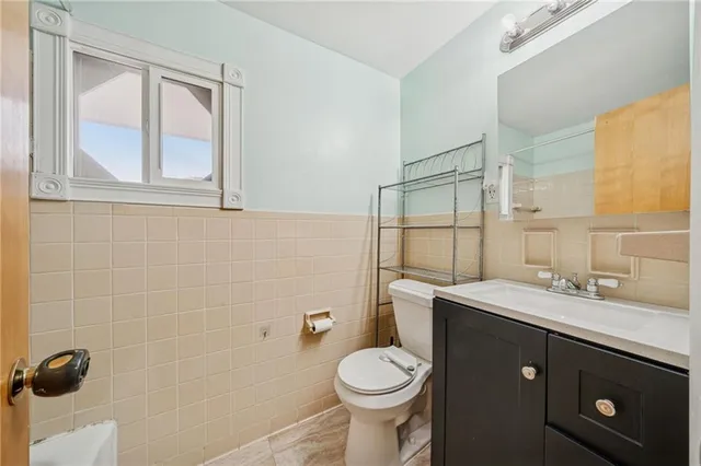 a bathroom with a sink toilet and vanity