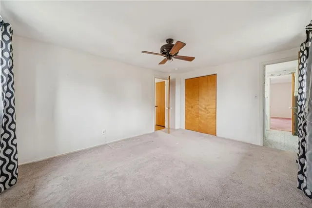 a view of empty room with windows