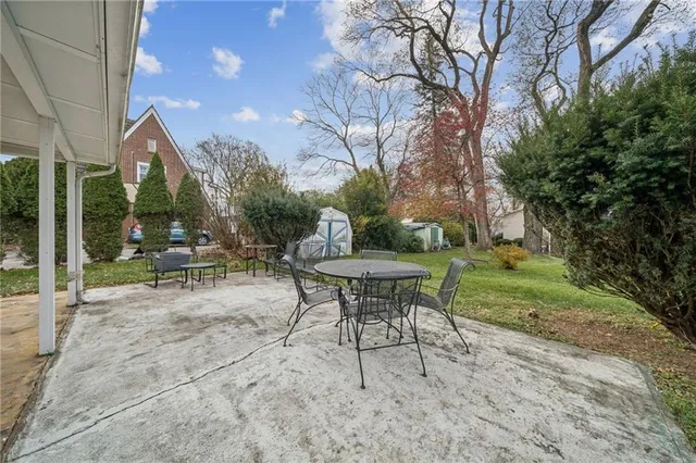 a view of a sitting area with furniture and wooden fence