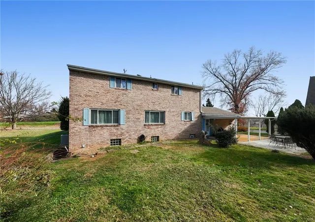 a view of house with yard