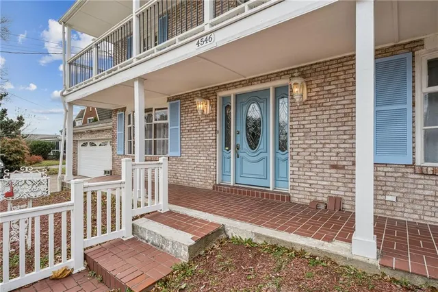 a front view of a house with a porch