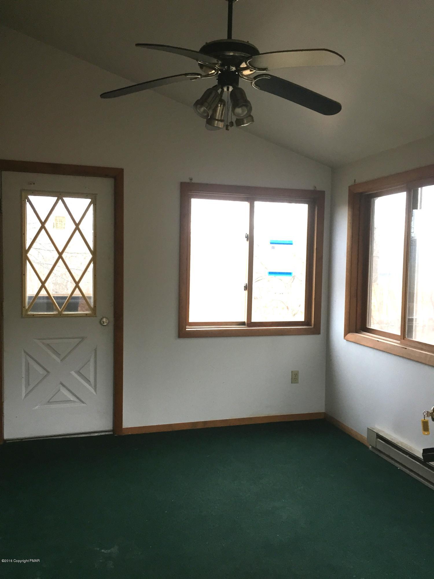 1231 Salisbury Road Bushkill, PA 18324 - Photo 4 of 16 a view of an empty room with a window