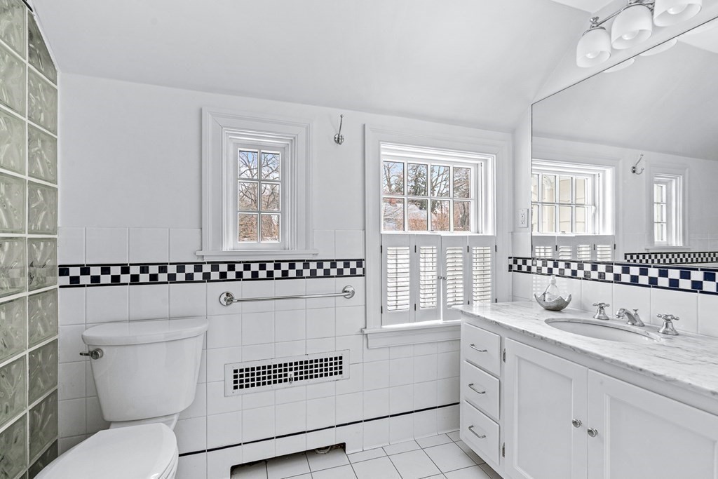 35 Sawyer Road Wellesley, MA 02481 - Photo 15 of 27 a bathroom with a granite countertop sink mirror vanity and toilet