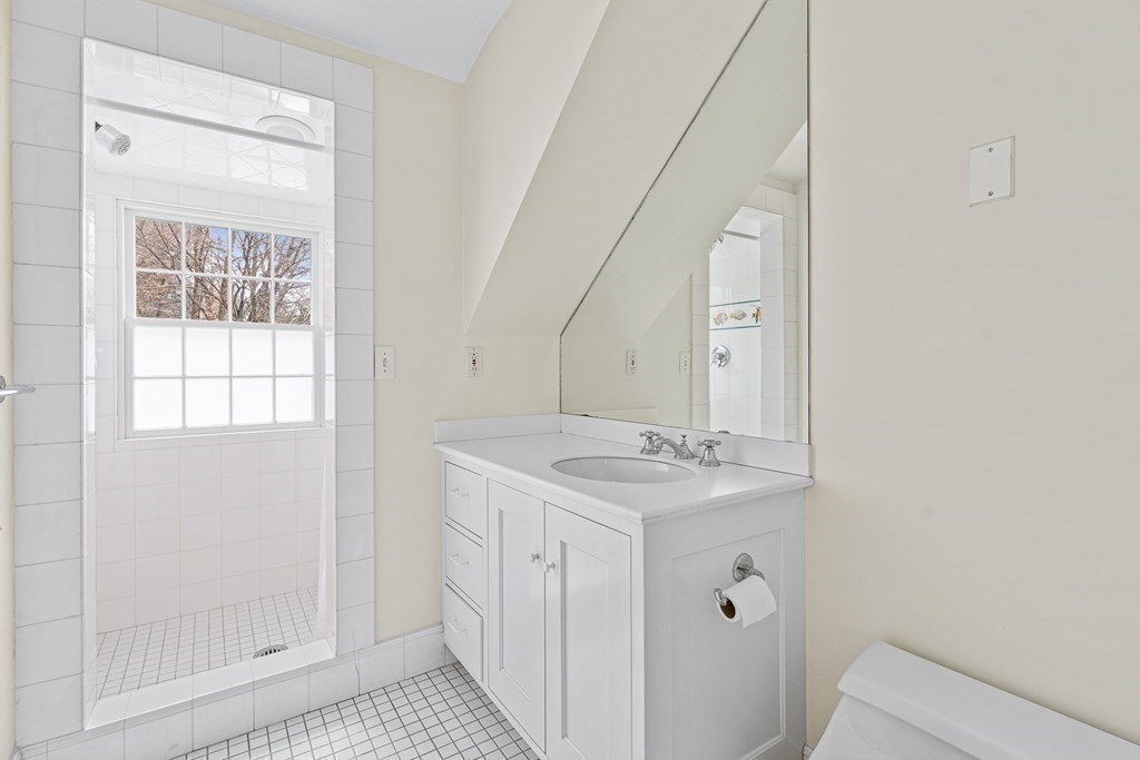 35 Sawyer Road Wellesley, MA 02481 - Photo 18 of 27 a bathroom with a sink a toilet and a mirror