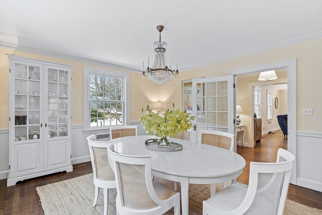 35 Sawyer Road Wellesley, MA 02481 - Photo 8 of 27 a dining room with furniture a chandelier and wooden floor