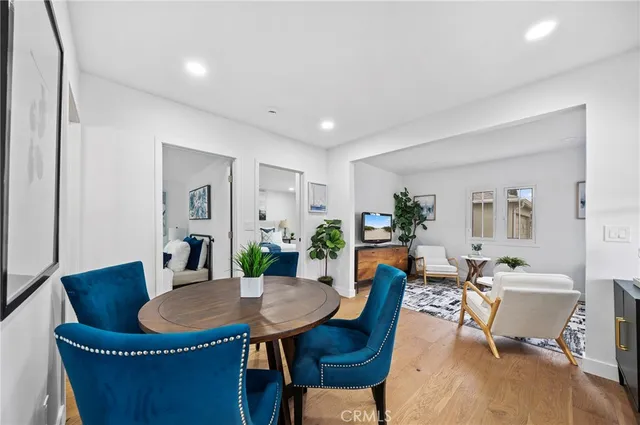 a dining room with furniture a table and chairs