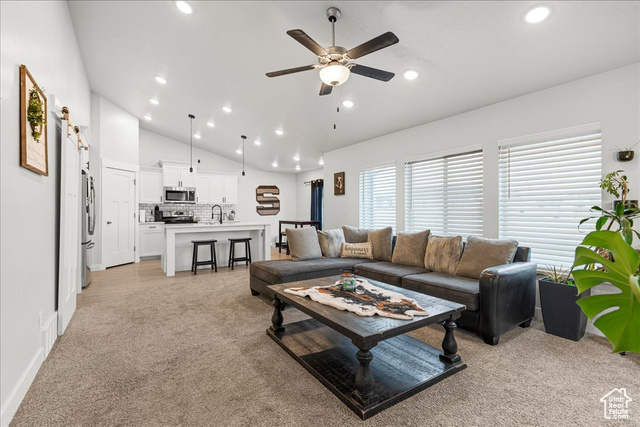 464 South Trejo Rdg Road Grantsville, UT 84029 - Photo 5 of 33 Living room featuring light carpet, vaulted ceiling, ceiling fan, and recessed lighting