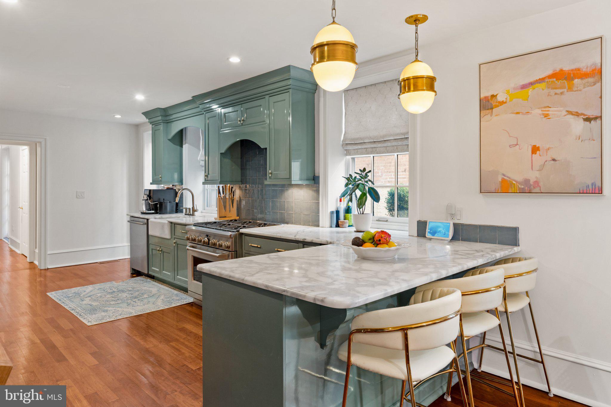 1013 Clinton Street Philadelphia, PA 19107 - Photo 12 of 53 a kitchen with a table and chairs in it