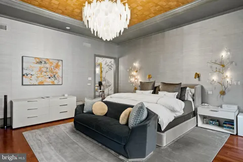 a bedroom with a bed and a fireplace