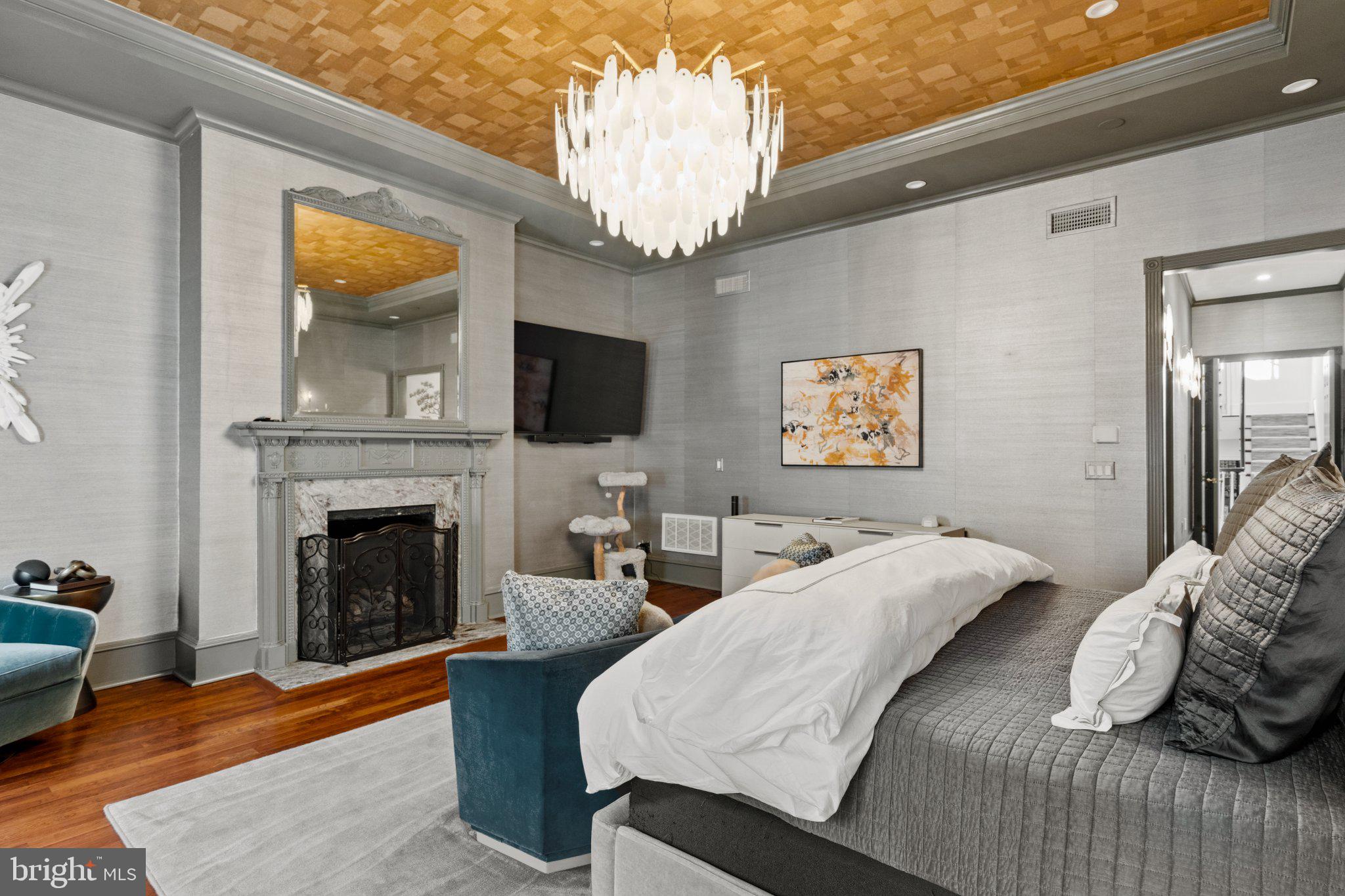 1013 Clinton Street Philadelphia, PA 19107 - Photo 22 of 53 a bedroom with a bed and a fireplace