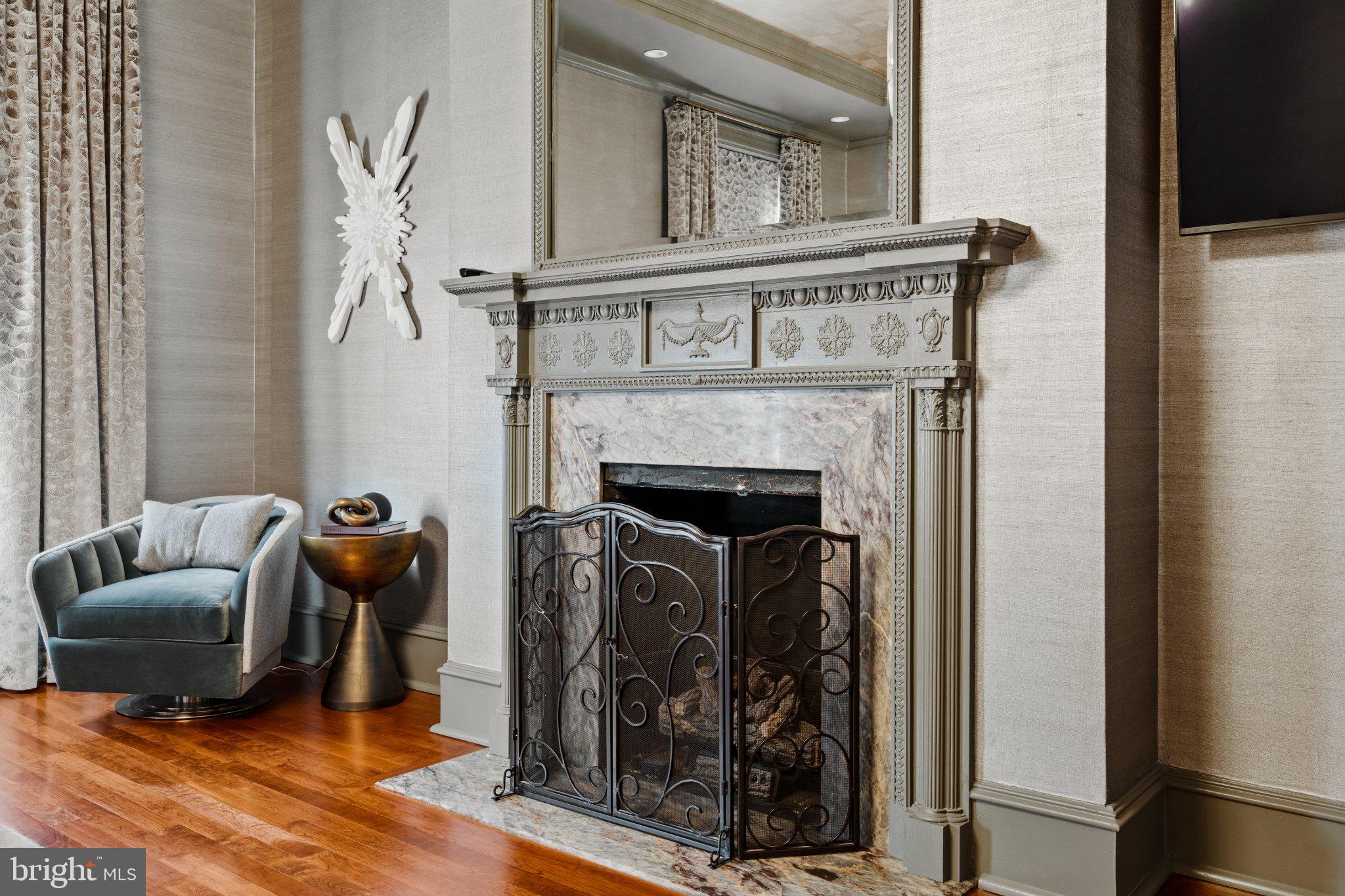 1013 Clinton Street Philadelphia, PA 19107 - Photo 23 of 53 a living room with furniture and a fireplace