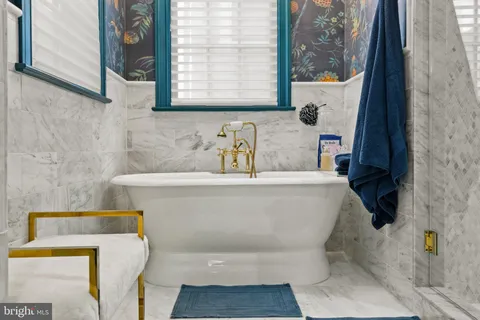 a bedroom with two beds and a window