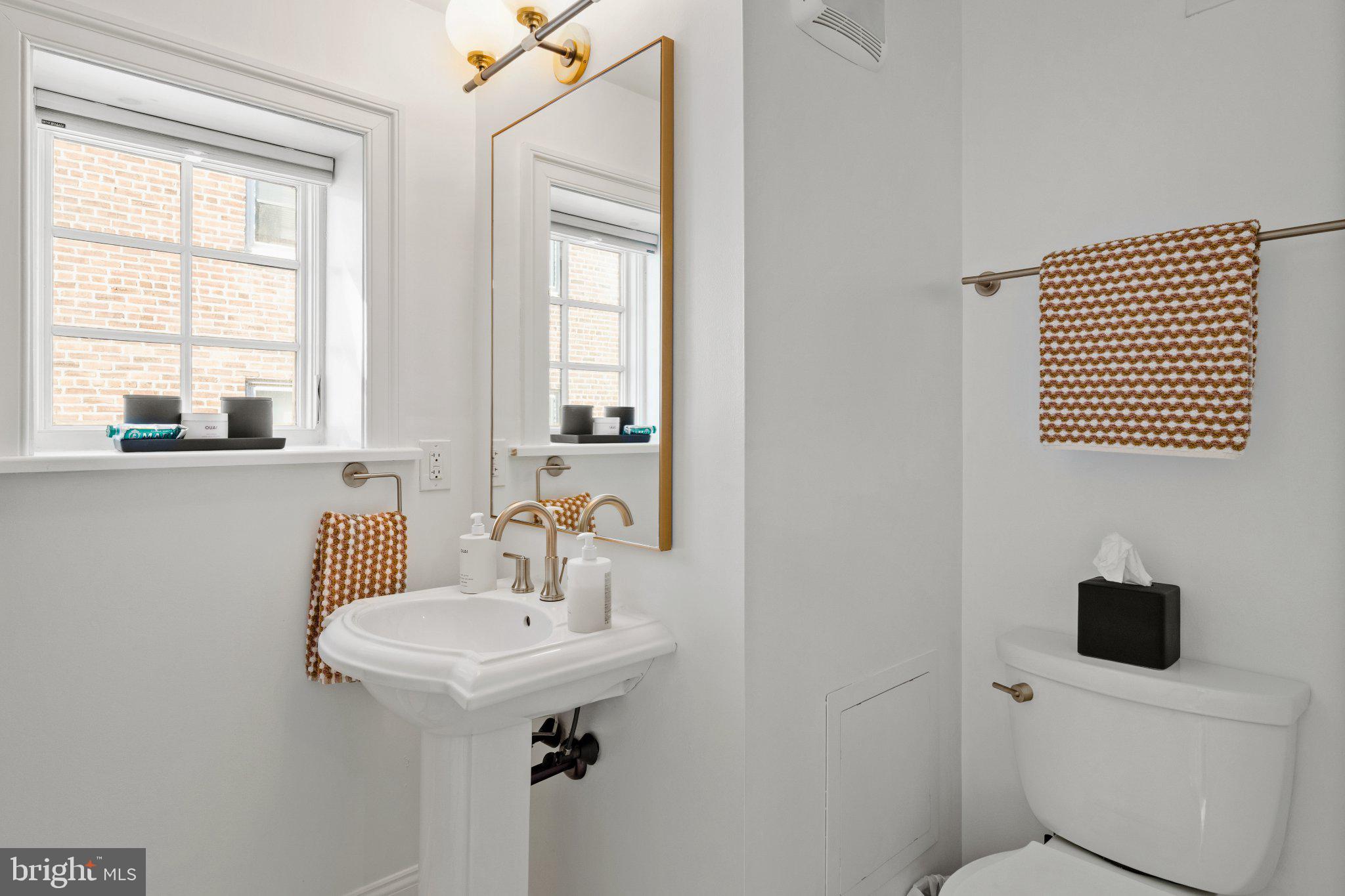 1013 Clinton Street Philadelphia, PA 19107 - Photo 34 of 53 a bathroom with a sink toilet and a mirror
