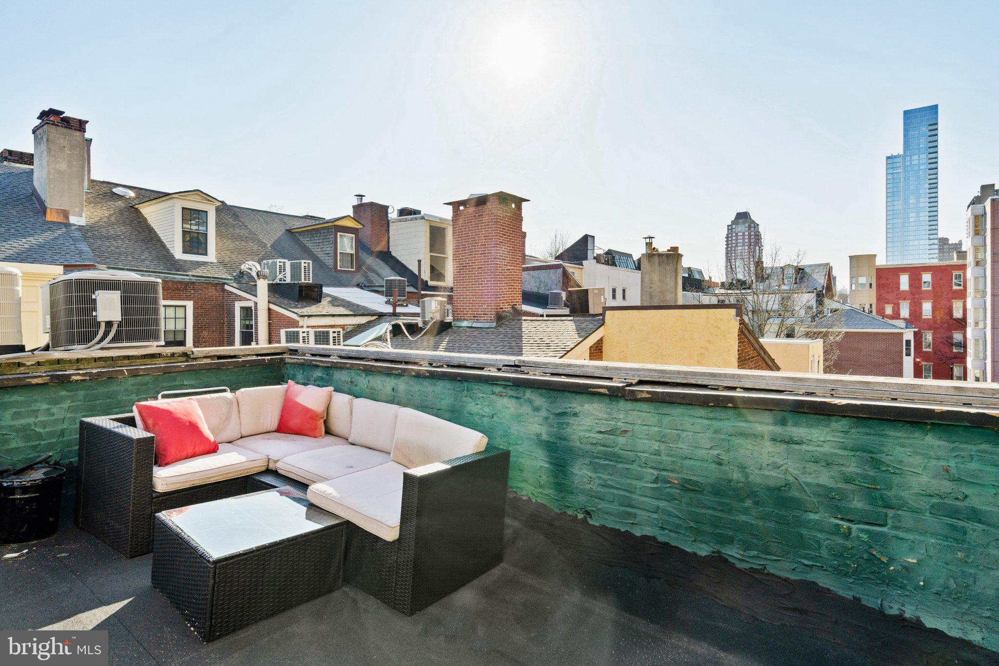 1013 Clinton Street Philadelphia, PA 19107 - Photo 37 of 53 a view of a lake with a chairs and table in the terrace