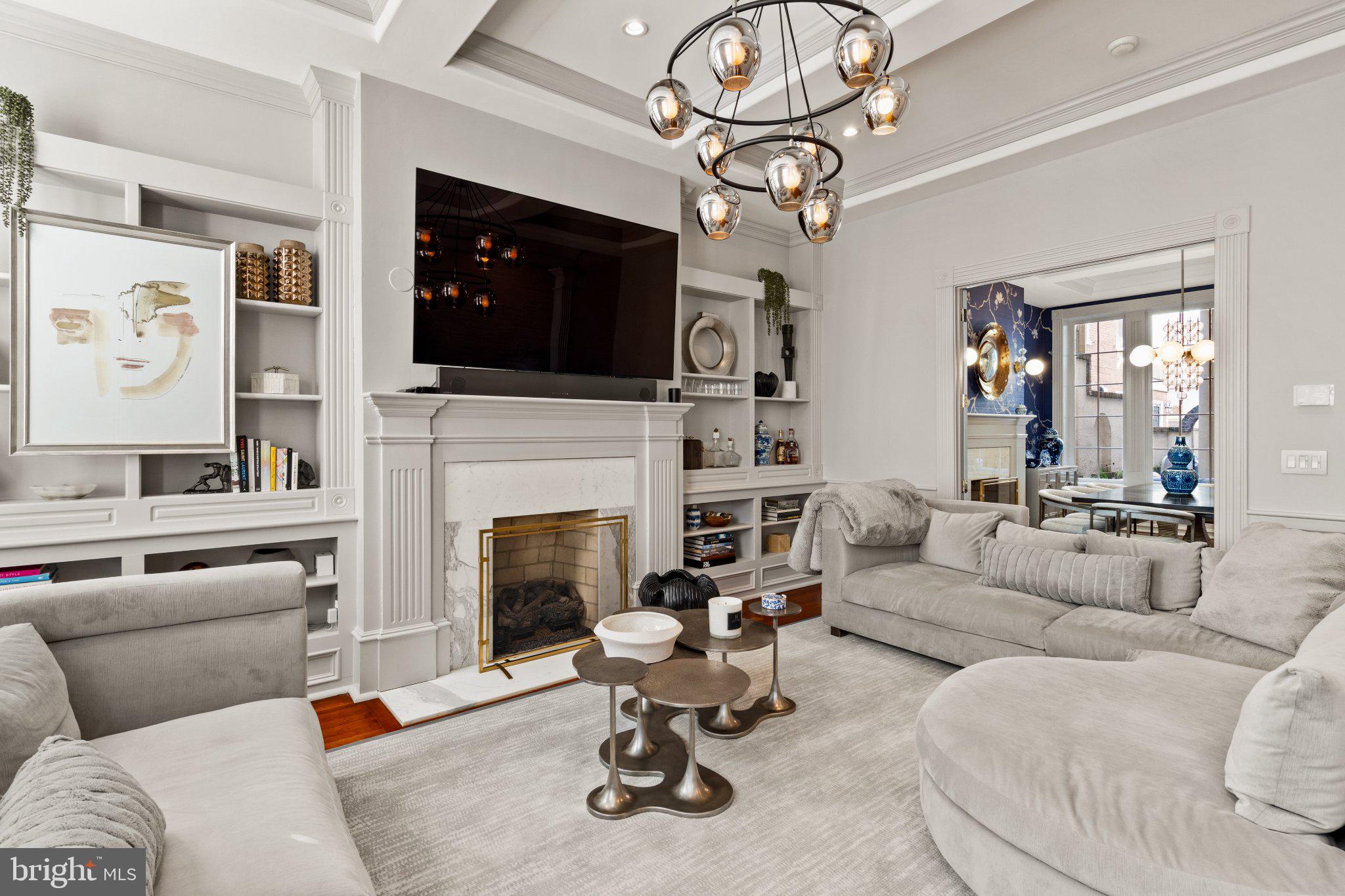 1013 Clinton Street Philadelphia, PA 19107 - Photo 4 of 53 a living room with furniture a fireplace and flat screen tv