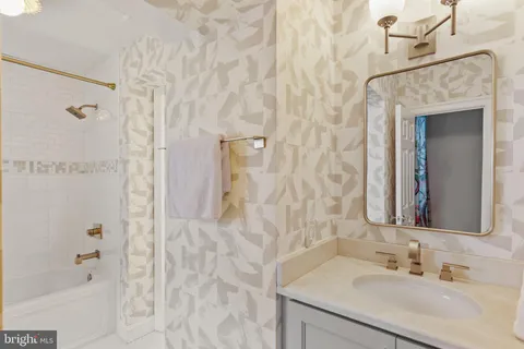 a bedroom with a bed and a lamp