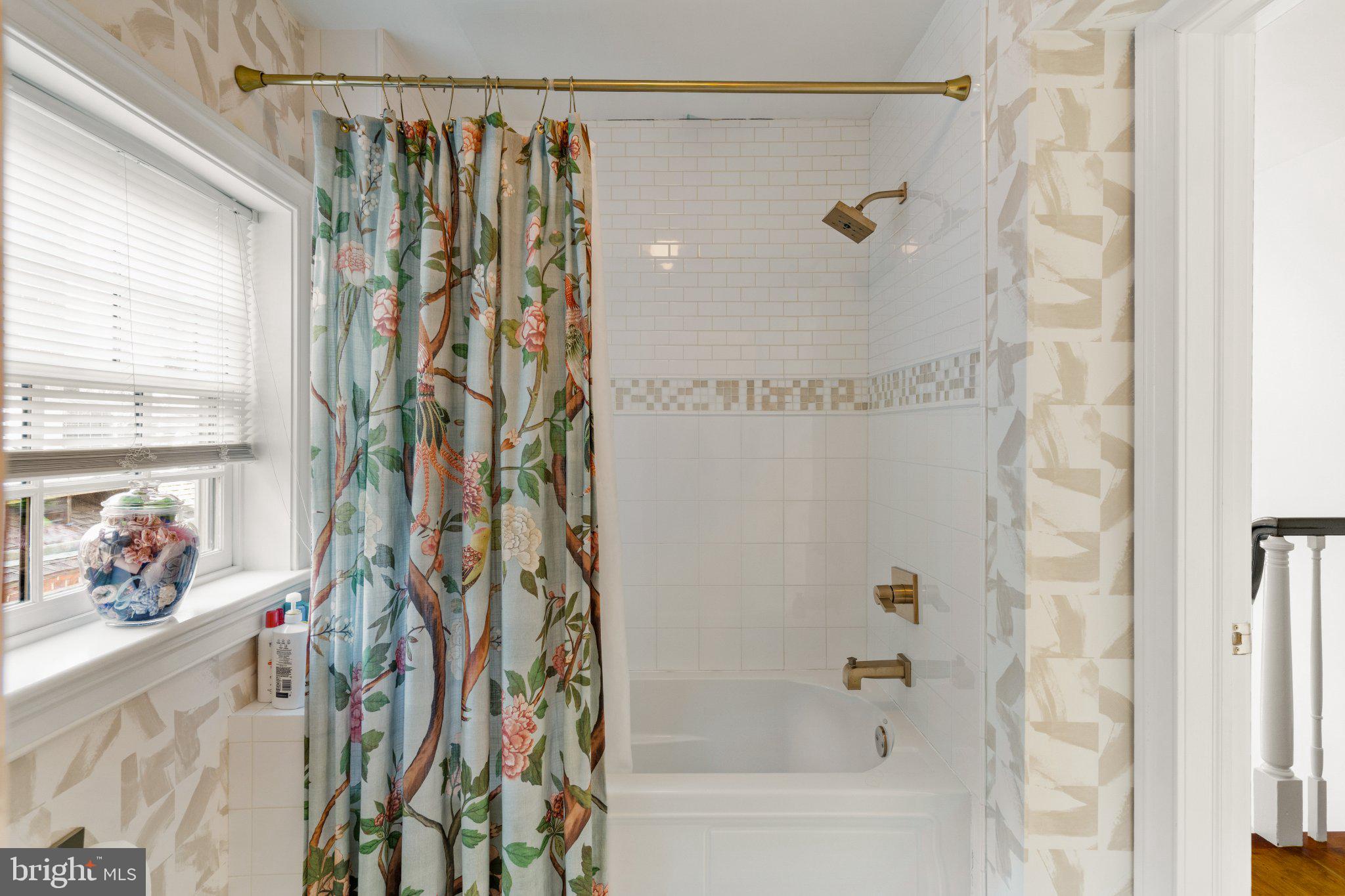 1013 Clinton Street Philadelphia, PA 19107 - Photo 43 of 53 a bathroom with a shower curtain and a window
