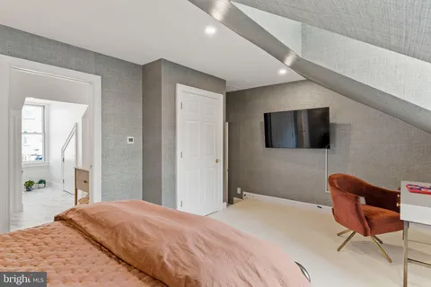 a children room with toys and a ceiling fan