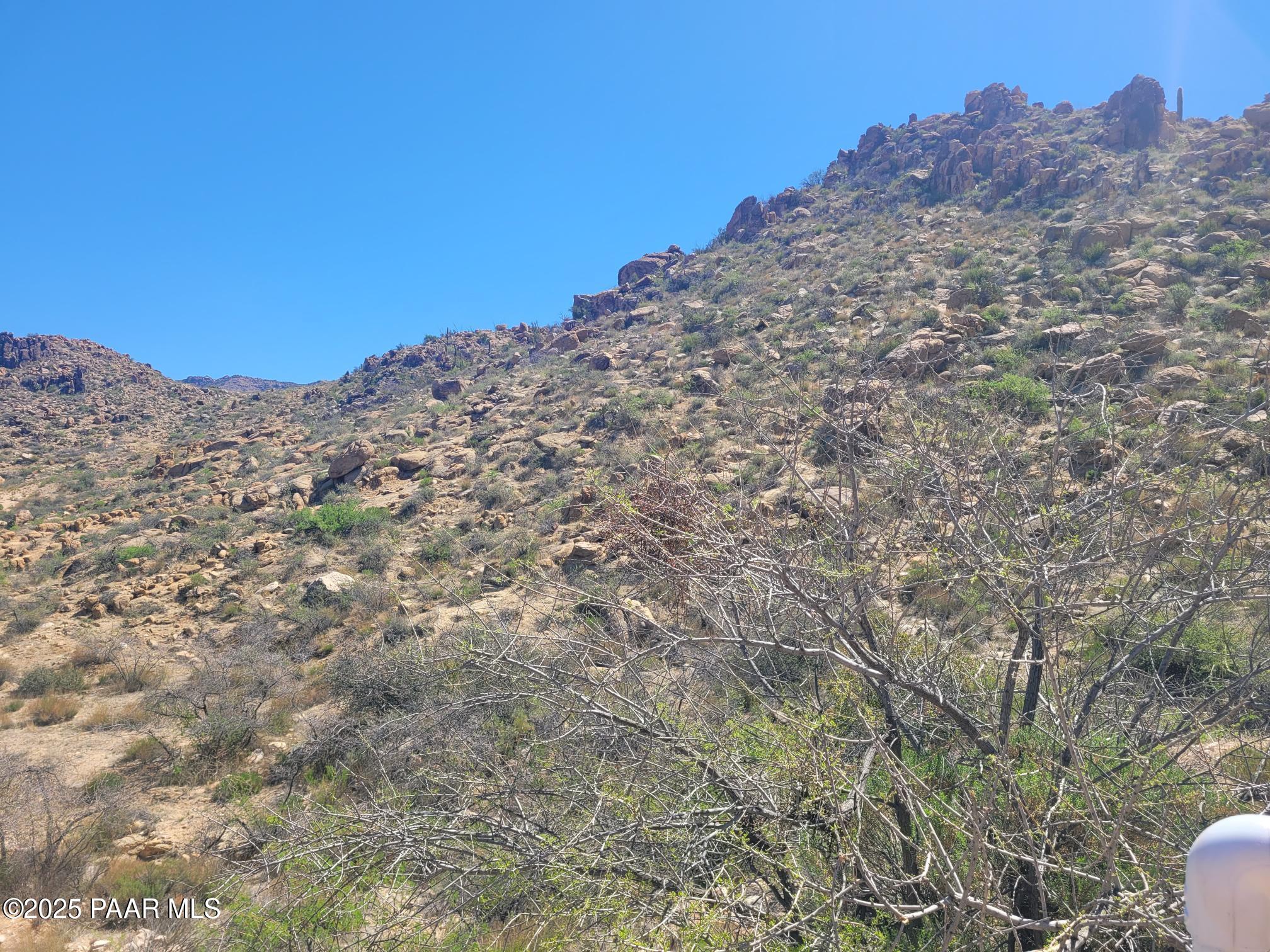 0 South Date Creek Road Congress, AZ 85332 - Photo 2 of 7 a view of a dry yard with mountains in the background