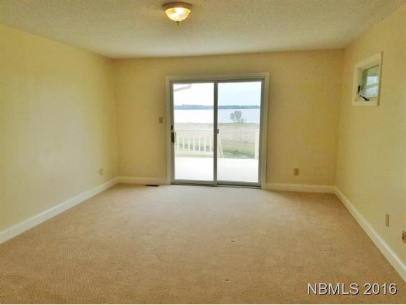 786 Weaver Camp Road Merritt, NC 28556 - Photo 11 of 26 Master Bedroom with Walk Out Deck