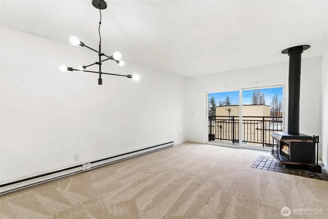 a view of a room with a ceiling fan and a wooden floor