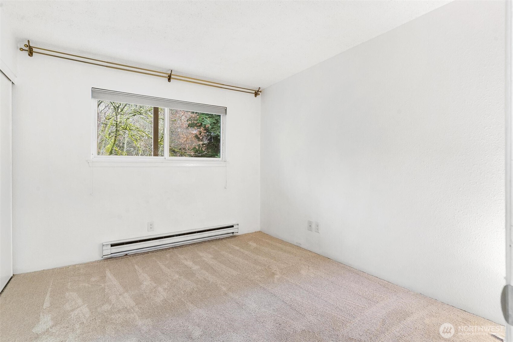 5832 Northeast 75th Street, Unit E304 Seattle, WA 98115 - Photo 18 of 36 an empty room with a window