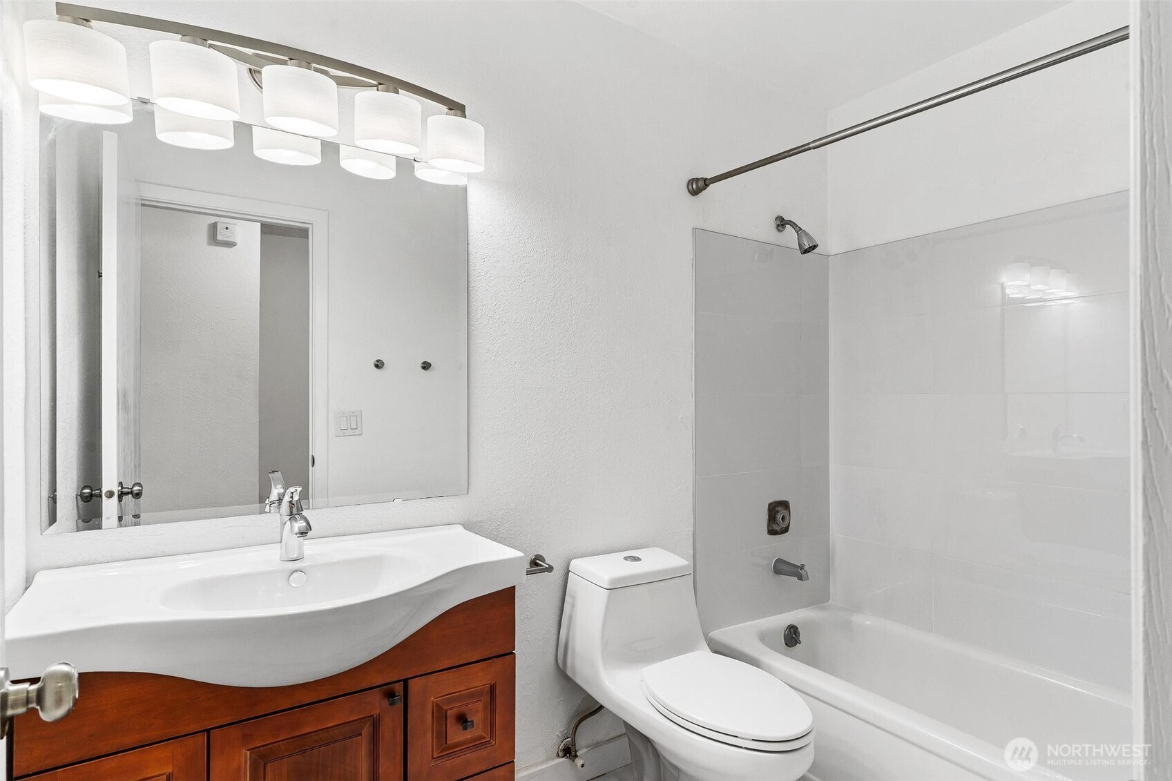 5832 Northeast 75th Street, Unit E304 Seattle, WA 98115 - Photo 21 of 36 a bathroom with a sink vanity granite toilet and shower